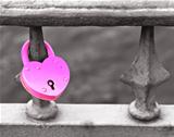 Pink padlock on the grille