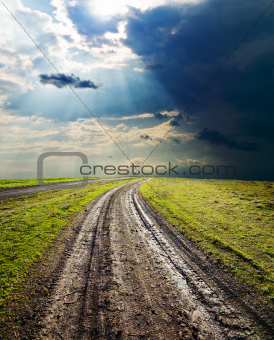 dirty road under dramatic sky