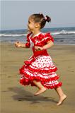 Happy child running on beach