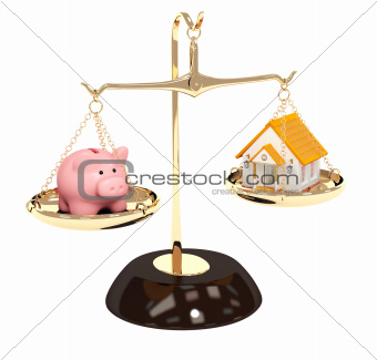 Piggy bank and house on bowls of scales