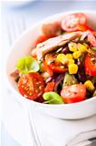 Mixed vegetable salad with tuna in a bowl