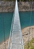 Alpine footbridge over lake