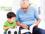 grandfather reading a story book for his grandson