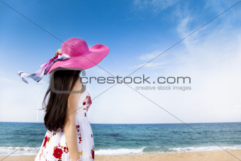 beautiful woman standing on the beach