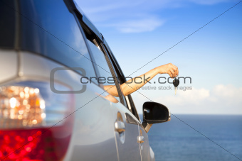 hand of woman holding car key
