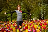 Woman in the middle of tulips