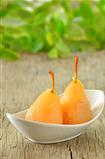 two pears poached in syrup 