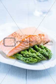 Salmon fillet on green asparagus