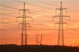 Electric power transmission lines at sunset