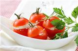 appetizer of stuffed tomatoes (soft cheese and parsley)