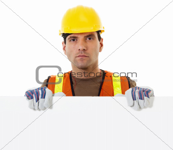 Construction worker holding blank sign