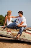 young couple on old boat
