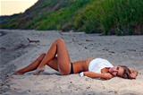 Beautiful young woman relaxing near the sea