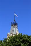 Quebec Flag over tower in trees