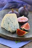 blue cheese and sweet fruit  figs on a wooden board