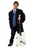 Boy in loose fitting suit stood with electric guitar
