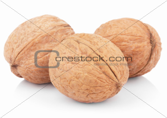 Three walnuts on white