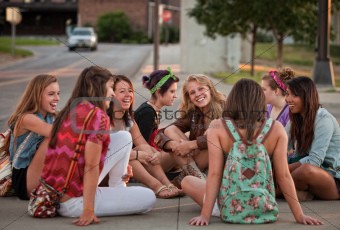 Female Students Sitting on the Ground