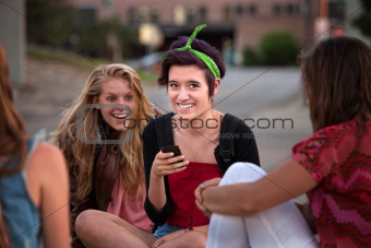 Excited Female Teens Looking at Phone