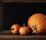 Different sized pumpkins on table 