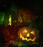 Halloween pumpkin in spooky cemetery