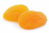 Two dried apricot fruits on white