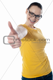 Pretty teenager showing thumbs-up