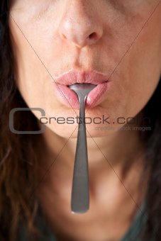 spoon in mouth face