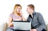 young couple with a laptop on the background of isolation