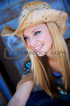 Attractive Blond Model Smiles While Wearing Cowboy Hat