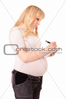 Pregnant woman makes notes
