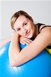 Pregnant woman relaxing against fitness ball