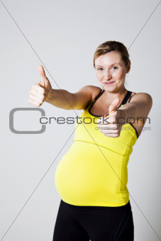 Pregnant woman doing thumbs up