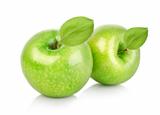 Two green apples with leaves