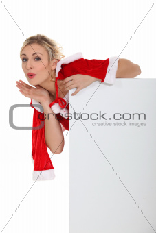 Blond woman dressed in Christmas outfit