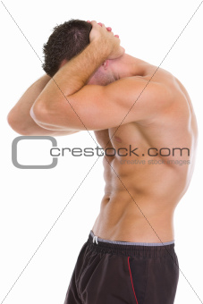 Muscular man showing abdominal muscles