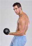 Strong sports man workout biceps with dumbbell