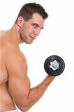 Athletic man with strong biceps rising dumbbell