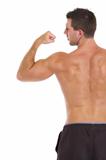 Strong sports man showing biceps. Rear view