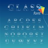 Glass alphabet on sky background.