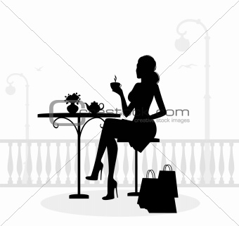 Silhouette of beautiful woman in cafe