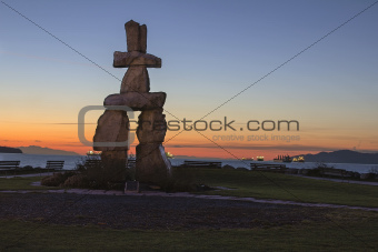 Inukshuk Stone Sculpture Sunset Beach Vancouver BC at Sunset