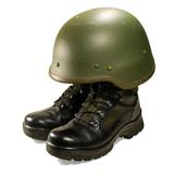 Soldier visual concept. Military boots and helmet.