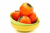 Ripe persimmons in a bowl.