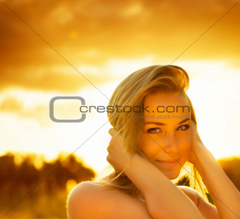 Beautiful female over sunset