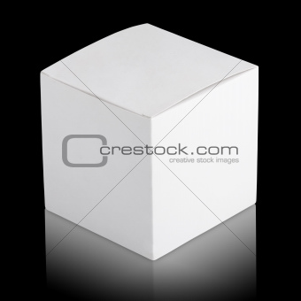 Closed white cardboard box on black