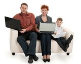 dad, mom and son with laptop