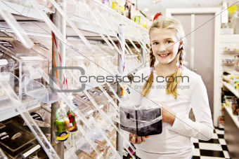 sweet shop girl, holding candy tub