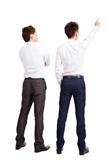 full length of two businessman pointing and looking