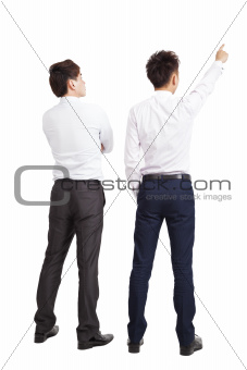 full length of two businessman pointing and looking